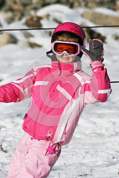 Girl ski skiing smiling winter snow rest vocation pink children kid trip travel