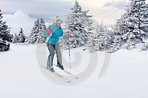 Girl skiers on the slope at ski resort in the mountain