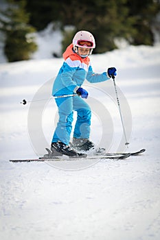 Girl sking on the slop