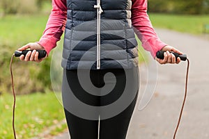 Girl skipping with a rope