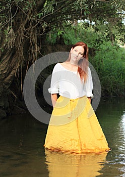 Girl in skirt in water