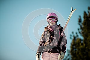 Girl with skis on back