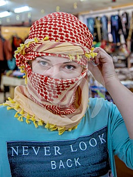 Girl of Slavic appearance wearing a headscarf Arab