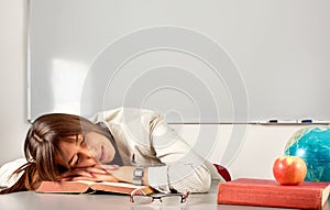 Girl sleeping in classroom