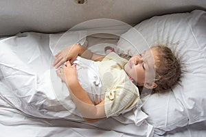 Girl sleeping on a cot in a train