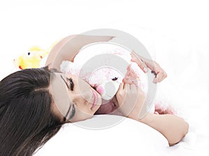 Girl sleeping with her teddy bear