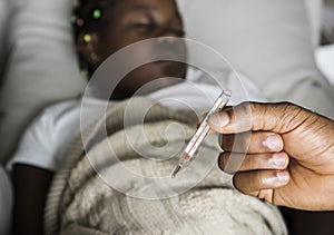 Girl sleeping with sickness on the bed photo