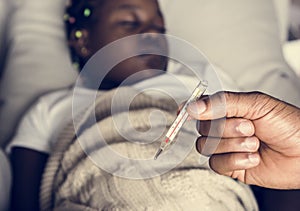 Girl sleeping with sickness on the bed