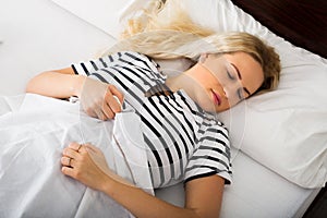 Girl sleeping with striped pygamas