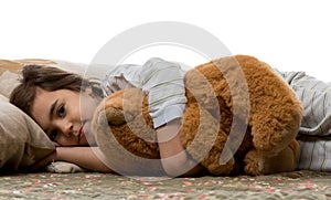 Girl sleeping with teddy bear