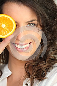 Girl with slice of orange