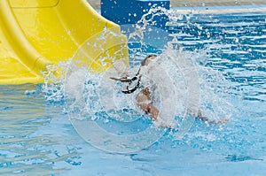 Girl sliding down water slide