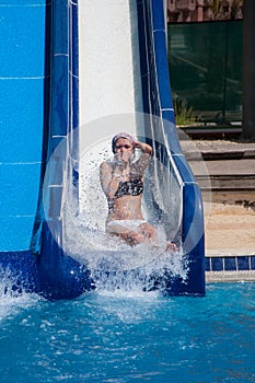 Girl sliding down water slides