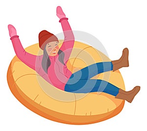 Girl sliding snow tubing. Happy child having fun