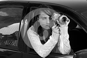 Girl with SLR photo camera