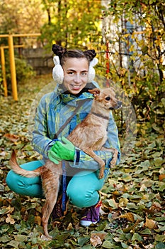 The girl and small dog. Autumn