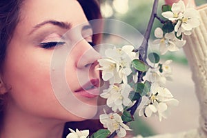 Girl smell tree flower