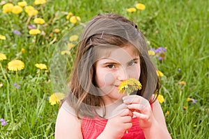 Girl Smelling Flower