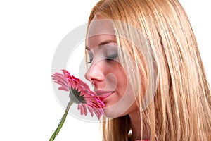 Girl smelling flower