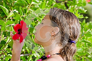 Girl smells an exotic flower
