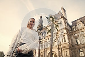 Girl smile in paris, france, bottom up view