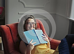 Girl smiling with a book