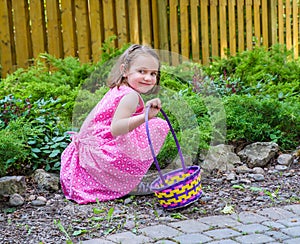 Girl Smiling During an Easter Egg Hunt