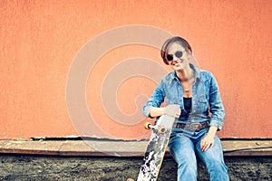 girl smiling and having fun with skateboard and longboard. Lifestyle concept of active modern life with good people