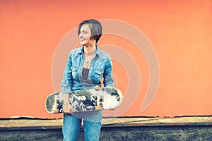 Girl smiling and laughing, skater on a sunny summer day with instragram filter and vintage effect