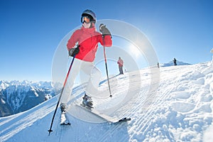 Girl smiling at ski at sunny day - winter fun