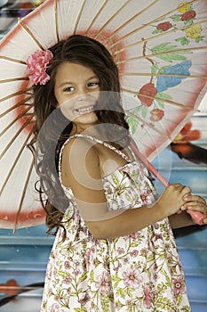 Girl smiling with umbrella