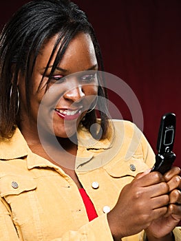 Girl Smiling While Using Cellphone