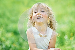 girl sniffing flowers of apple orchard. garden with flowering trees