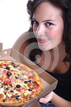 Girl sniffing pizza photo