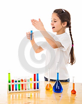 Girl sniffs a chemical reagent photo