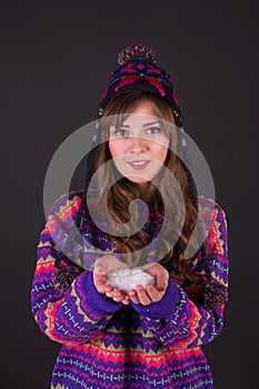 Girl with snow in hands