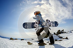 Girl snowboarder enjoys the ski resort