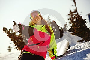 Girl snowboarder enjoys the ski resort