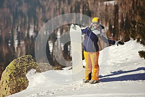 Girl snowboarder enjoys the ski resort