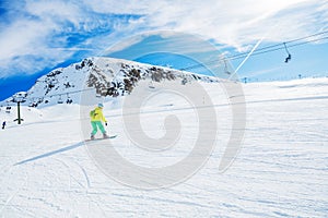 Girl snowboarder enjoys the winter ski resort.