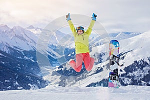 Girl snowboarder enjoys the winter ski resort.