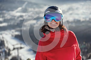 Girl snowboarder in helmet and mask