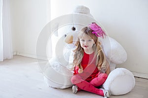 Girl with soft polar bear toy gift