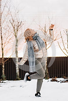 Girl with sparkler. Holiday on the nose. Day before Christmas. Dancing on the snow