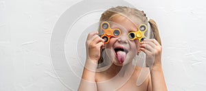 Girl with a spinner in studio