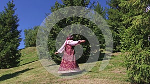 Girl spinning in a Sarafan