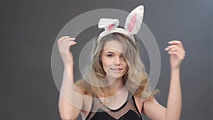 Girl spins with bunny ears on head