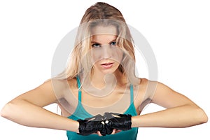 Girl in a sports vest and gloves clenches fists