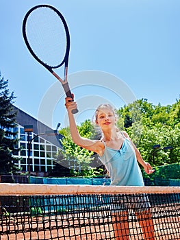 Girl sportsman with racket and ball on tennis