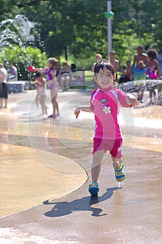 Girl in spray pad